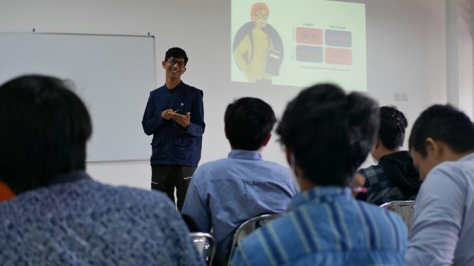 a man standing in front of a group of people